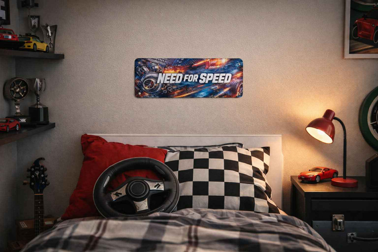 Racing-themed bedroom with Need for Speed wall art, checkered pillow, and model cars.